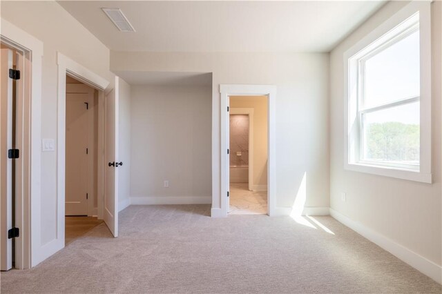 4202 Adler Cir, Buford, GA 30519 - unfurnished bedroom featuring visible vents, baseboards, a closet, a spacious closet, and light carpet