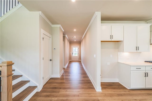 4202 Adler Cir, Buford, GA 30519 - hall with crown molding, visible vents, recessed lighting, wood finished floors, and baseboards