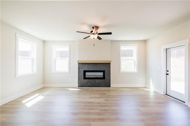 4202 Adler Cir, Buford, GA 30519 - unfurnished living room with stairs, light wood-style floors, baseboards, and crown molding