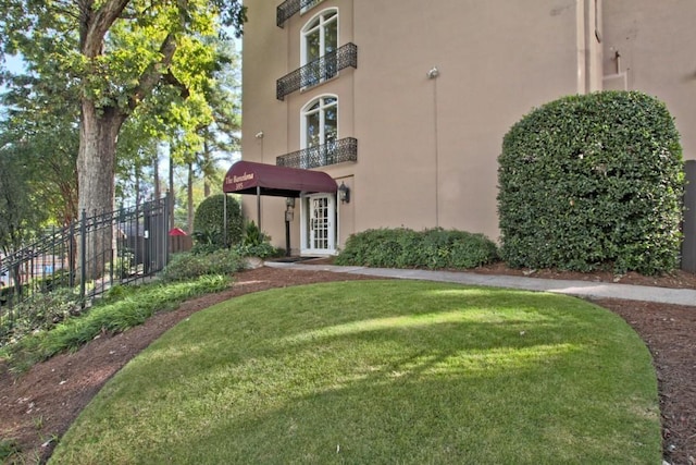 view of property with fence