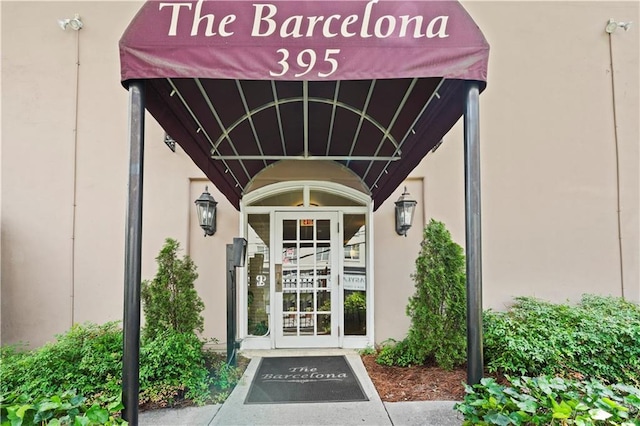395 Pharr Rd NE Unit 103, Atlanta, GA 30305 - property entrance featuring stucco siding and french doors