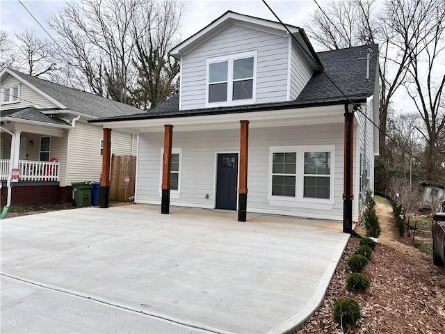 view of front of home featuring a porch and a shingled roof