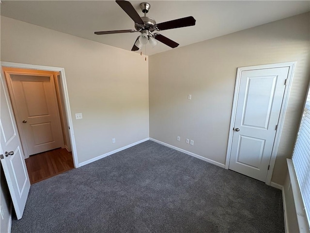 unfurnished bedroom with baseboards, carpet, and ceiling fan