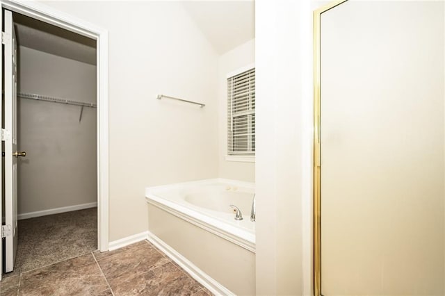 bathroom with independent shower and bath and lofted ceiling