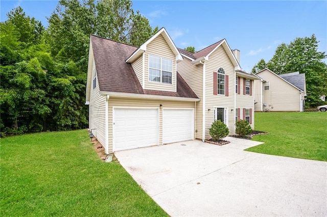 view of front of house featuring a garage and a front yard