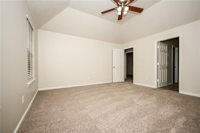 unfurnished bedroom with lofted ceiling, carpet flooring, and ceiling fan