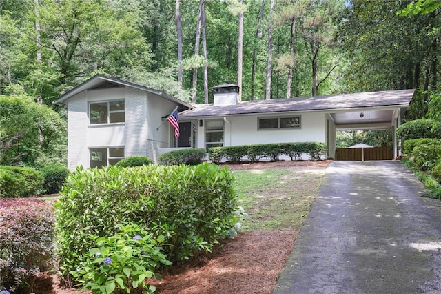 2800 Mornington Dr NW, Atlanta, GA 30327 - view of front of home with driveway, a chimney, and a carport