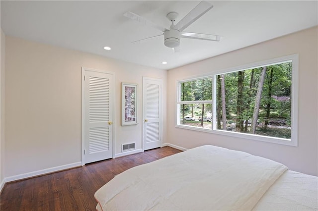 2800 Mornington Dr NW, Atlanta, GA 30327 - bedroom with wood finished floors, recessed lighting, a ceiling fan, and two closets