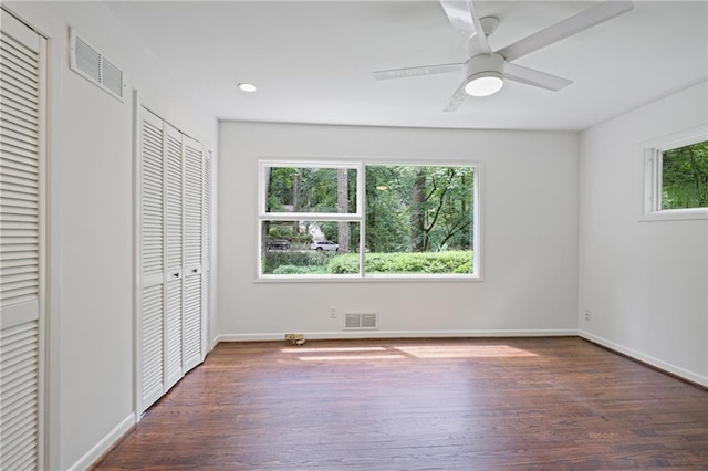 2800 Mornington Dr NW, Atlanta, GA 30327 - unfurnished bedroom with wood finished floors, two closets, ceiling fan, and recessed lighting