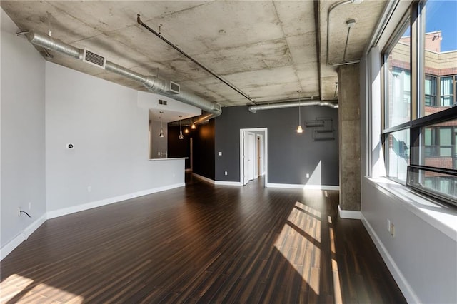 115 W Peachtree Pl NW Unit 602, Atlanta, GA 30313 - unfurnished living room featuring wood finished floors and baseboards