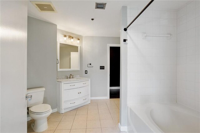 115 W Peachtree Pl NW Unit 602, Atlanta, GA 30313 - full bathroom featuring toilet, tile patterned flooring, baseboards, and vanity