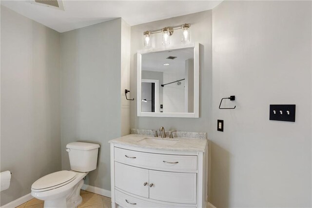115 W Peachtree Pl NW Unit 602, Atlanta, GA 30313 - bathroom featuring toilet, baseboards, tile patterned flooring, and vanity