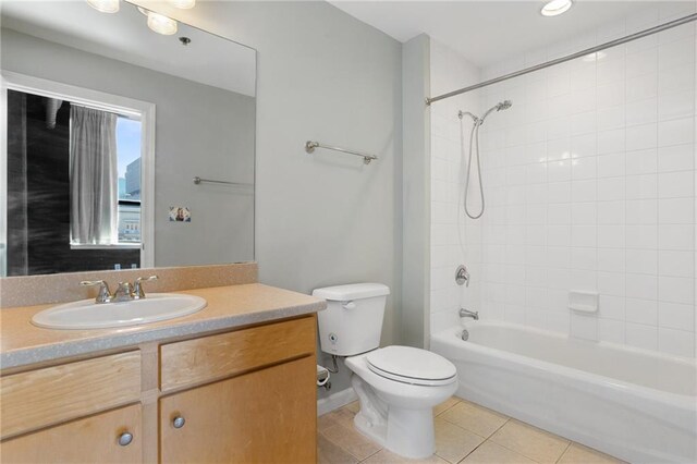 115 W Peachtree Pl NW Unit 602, Atlanta, GA 30313 - bathroom featuring toilet, tile patterned flooring, vanity, and washtub / shower combination