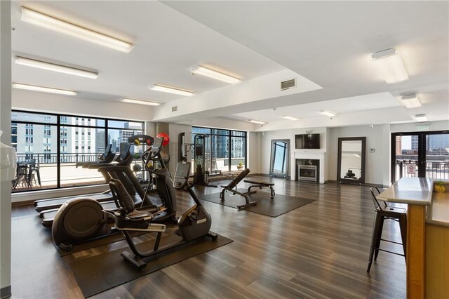 115 W Peachtree Pl NW Unit 602, Atlanta, GA 30313 - workout area featuring plenty of natural light and wood finished floors