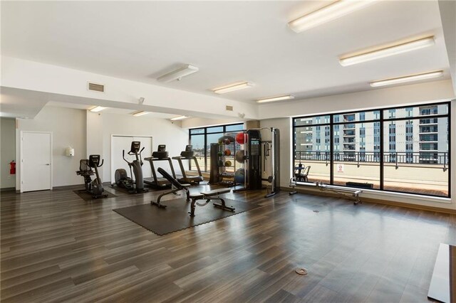 115 W Peachtree Pl NW Unit 602, Atlanta, GA 30313 - exercise room with wood finished floors and baseboards