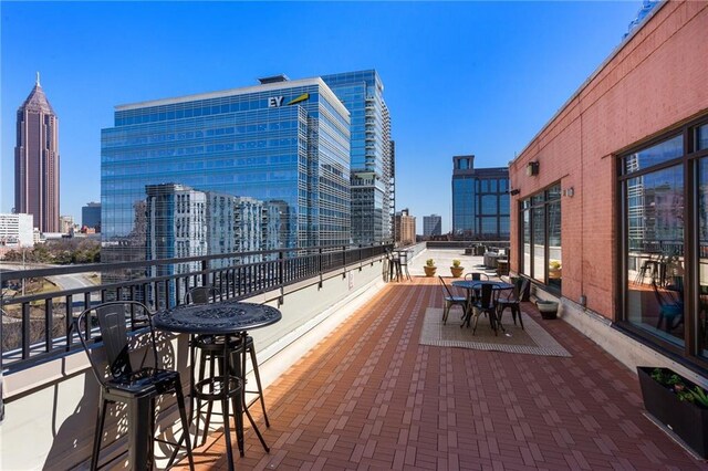 115 W Peachtree Pl NW Unit 602, Atlanta, GA 30313 - view of patio featuring a view of skyline and a balcony