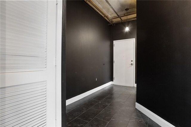 115 W Peachtree Pl NW Unit 602, Atlanta, GA 30313 - spare room featuring baseboards and dark marble finish flooring