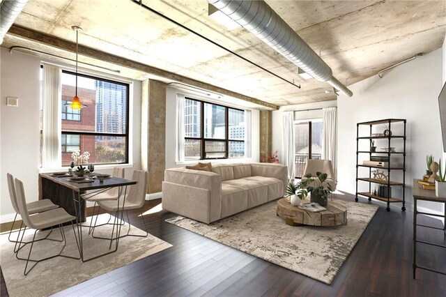 115 W Peachtree Pl NW Unit 602, Atlanta, GA 30313 - living room with dark wood finished floors, healthy amount of natural light, and baseboards