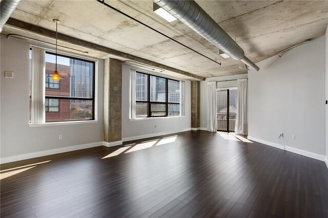 115 W Peachtree Pl NW Unit 602, Atlanta, GA 30313 - unfurnished room featuring dark wood-style floors and baseboards