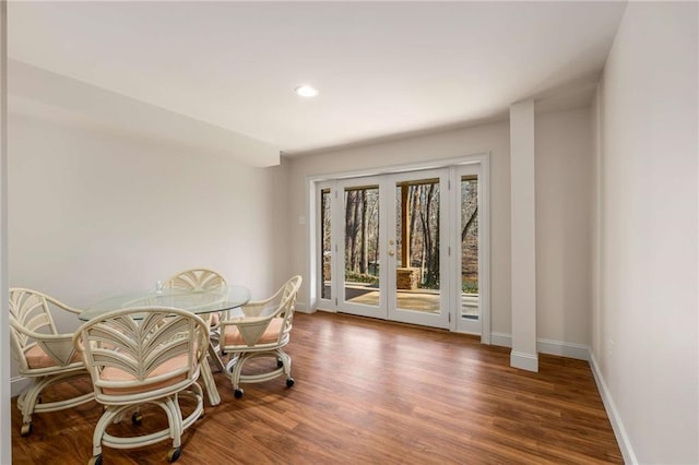 dining area featuring dark hardwood / wood-style flooring and french doors