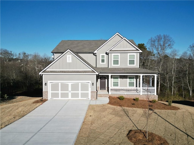 view of front of house with a garage and covered porch