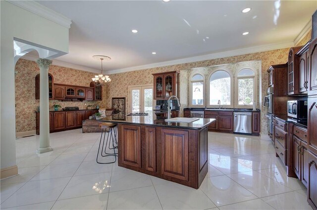 living room featuring french doors, hardwood / wood-style flooring, an inviting chandelier, and a healthy amount of sunlight