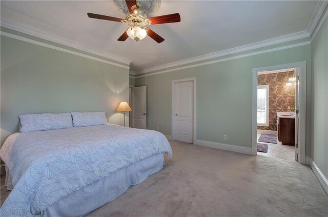 bedroom featuring ceiling fan, carpet floors, and ornamental molding