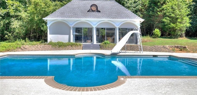 view of pool featuring a water slide