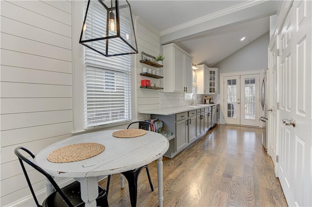 kitchen with light wood-style flooring, light countertops, french doors, gray cabinets, and open shelves