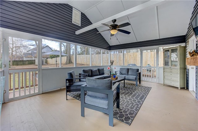 sunroom featuring vaulted ceiling and a ceiling fan