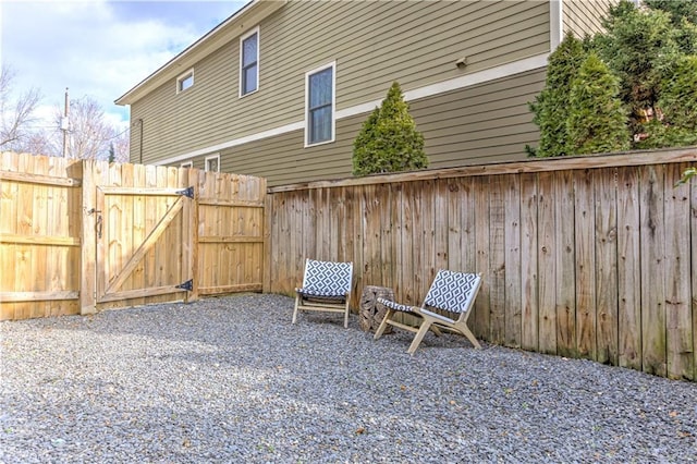 view of patio featuring a gate and fence