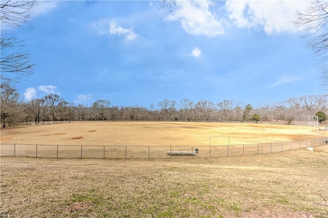 view of yard with a rural view and fence