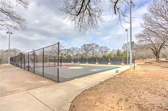 view of basketball court featuring community basketball court and fence