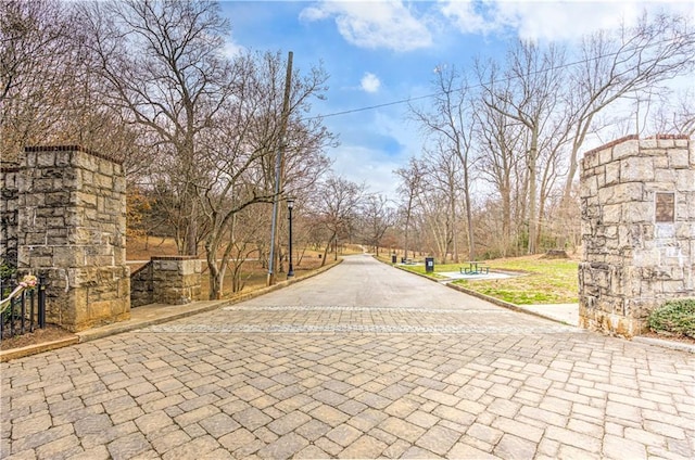 view of road featuring curbs