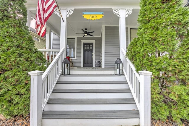 view of exterior entry featuring covered porch