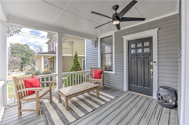 sunroom / solarium featuring ceiling fan and a wealth of natural light