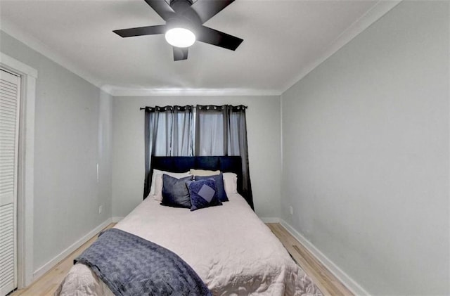 bedroom with wood-type flooring and ceiling fan