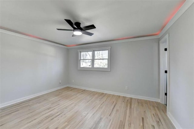 spare room featuring crown molding, ceiling fan, and light hardwood / wood-style floors