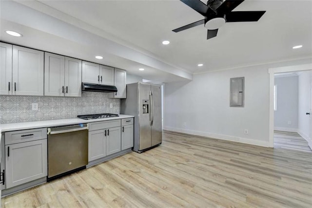 kitchen featuring tasteful backsplash, appliances with stainless steel finishes, gray cabinets, and light hardwood / wood-style floors