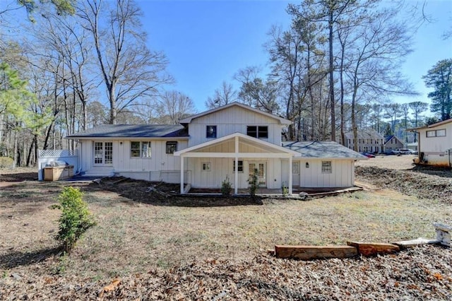 rear view of house with a porch