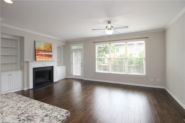 unfurnished living room featuring a fireplace with flush hearth, a ceiling fan, baseboards, dark wood finished floors, and crown molding