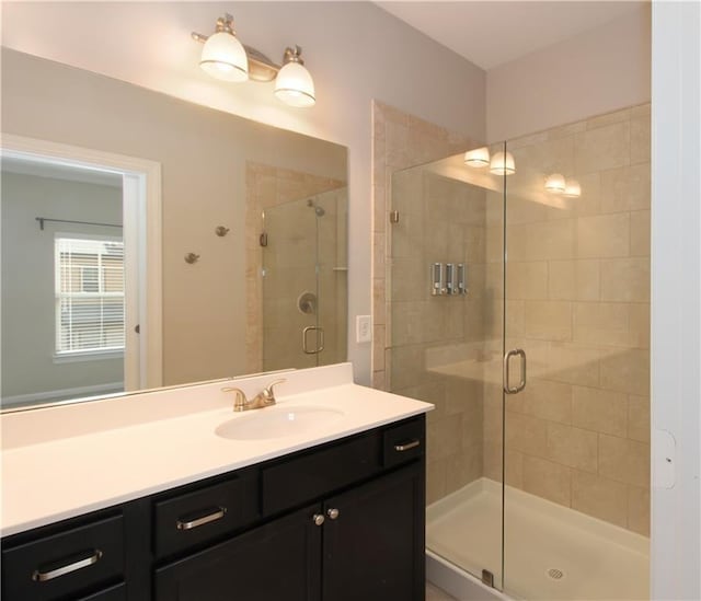 full bath featuring a shower stall and vanity