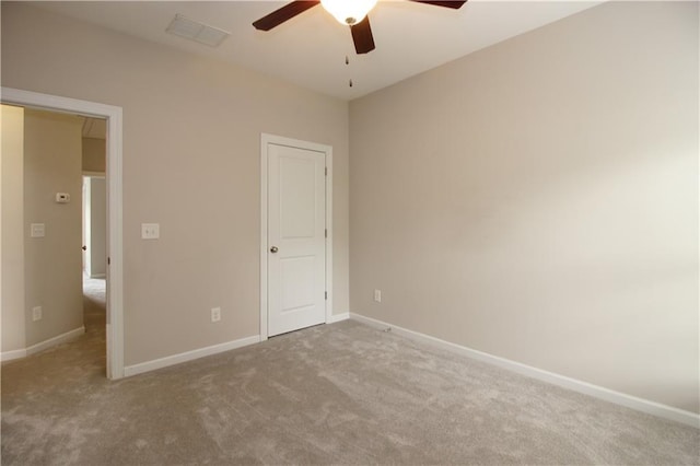 unfurnished bedroom with carpet flooring, baseboards, and a ceiling fan