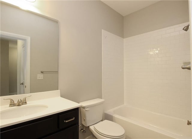 full bath featuring toilet, vanity, and shower / washtub combination