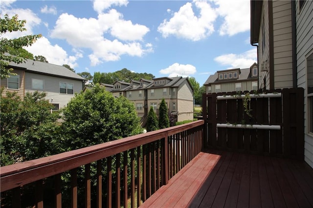 wooden deck with a residential view