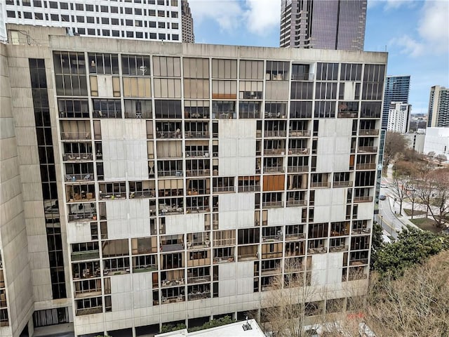 view of apartment building / complex featuring a city view