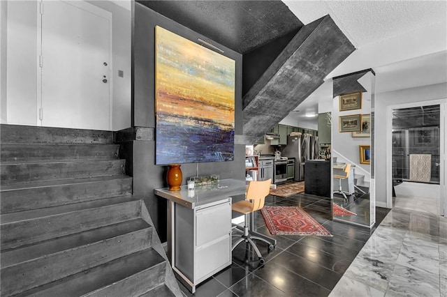 home office featuring a textured ceiling