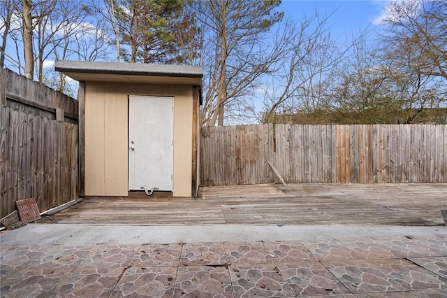 view of shed with a fenced backyard