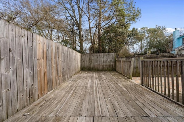 wooden terrace featuring fence