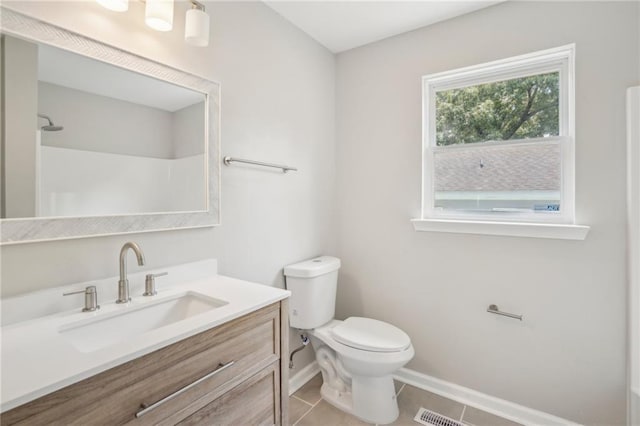 789 Third St, Stone Mountain, GA 30083 - bathroom featuring baseboards, toilet, tile patterned flooring, vanity, and a shower